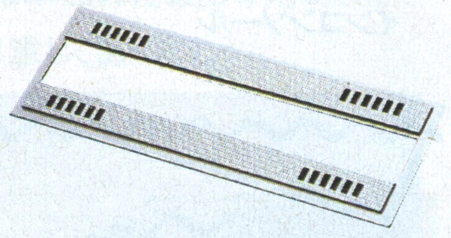 Rectangular paper object with slots, possibly a vintage punch card used in early computing or data processing.