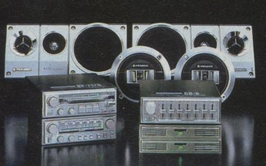 Vintage Pioneer car audio system components against dark background. Includes speakers and equalizers. Retro electronics.