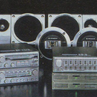 Vintage Pioneer car audio system components against dark background. Includes speakers and equalizers. Retro electronics.
