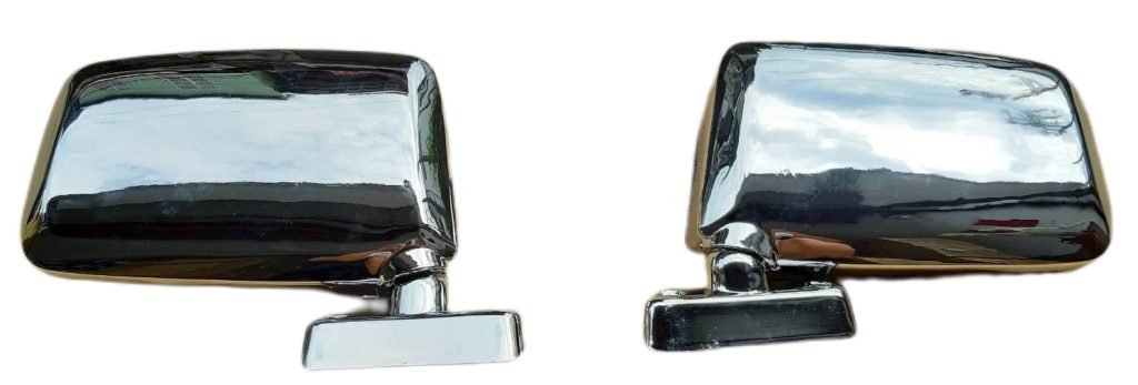 Chrome side mirrors with adjustable bases reflecting a cloudy sky, suitable for classic and vintage car models.