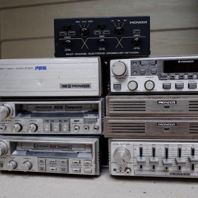 Vintage Pioneer audio equipment including a stereo main amplifier, component systems, and an electronic crossover network.