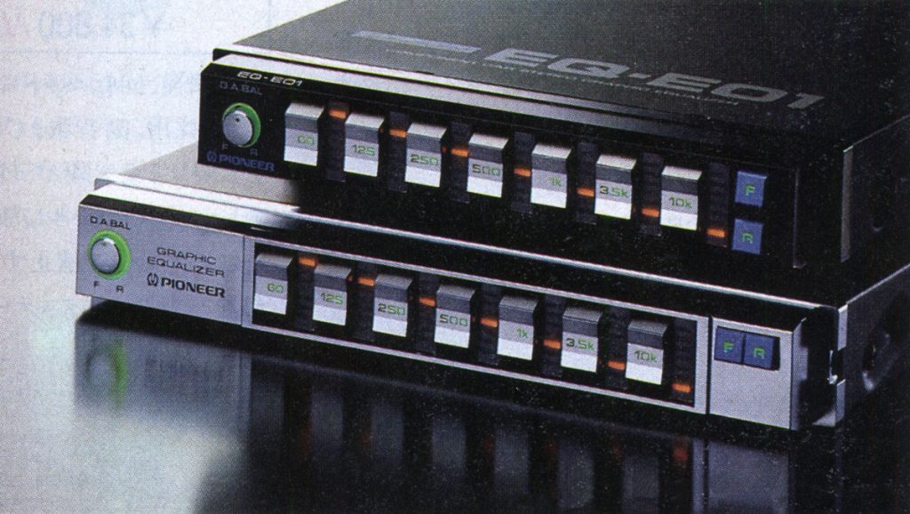Close-up of Pioneer graphic equalizers EQ-E01 with frequency adjustment sliders, front view on a reflective surface.