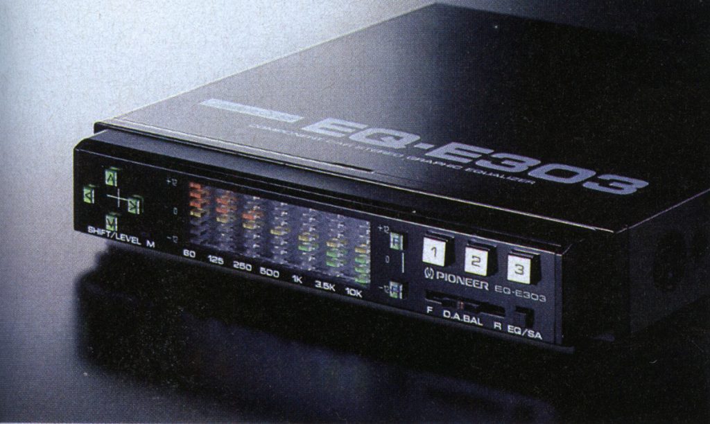 Pioneer EQ-E303 audio equalizer with LED display showing frequency levels, buttons labeled 1, 2, 3, and various controls.