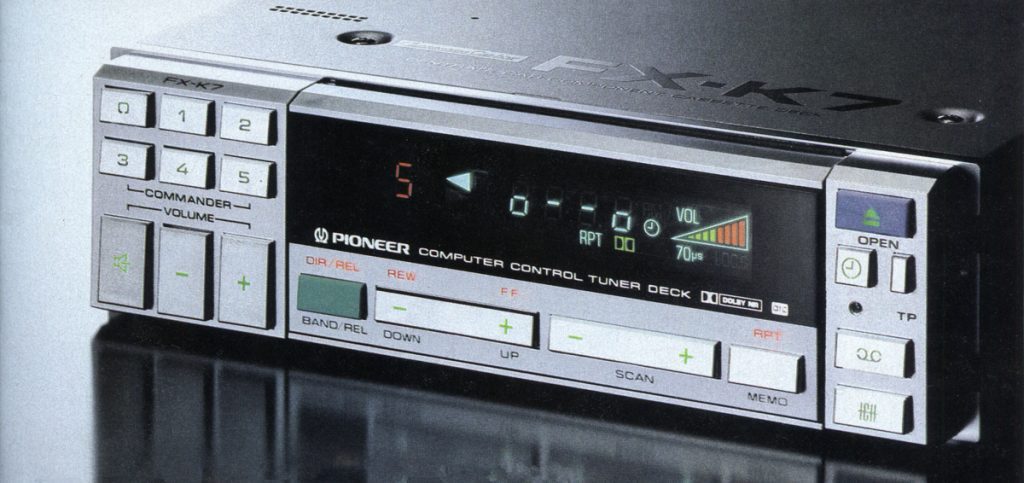 Vintage Pioneer FX-K7 car stereo tuner deck, featuring computer control and various operation buttons in Japanese.