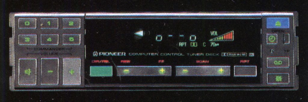 Vintage Pioneer computer control tuner deck with illuminated buttons and digital display for 80s car audio system.