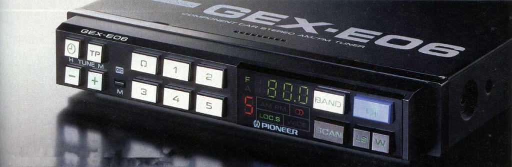 Vintage Pioneer GEX-E06 car stereo AM/FM tuner with digital display, control buttons, and frequency indicator.