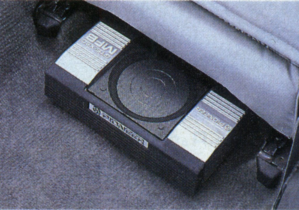 Pioneer MF-5 cassette tape in a fabric pocket, with visible branding in Japanese next to English labels