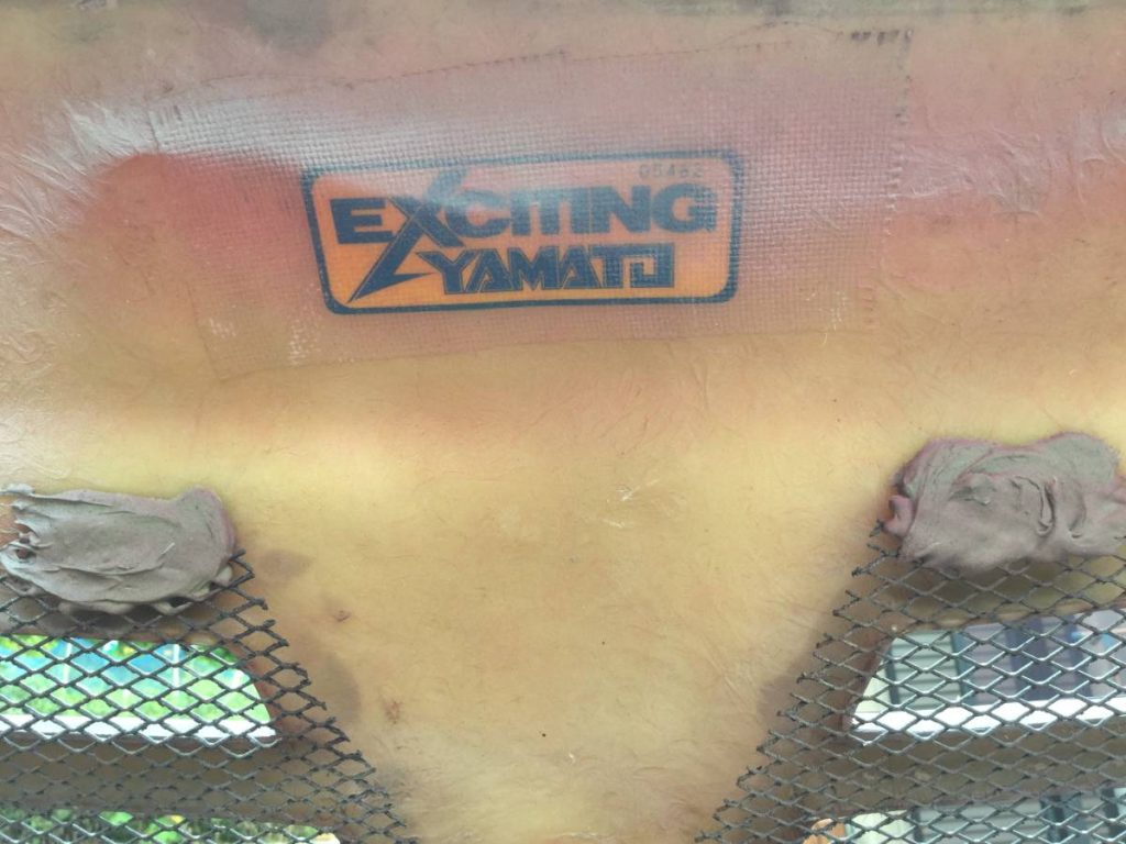 Exciting YAMATO label on a yellow material surface with mesh and clay details.