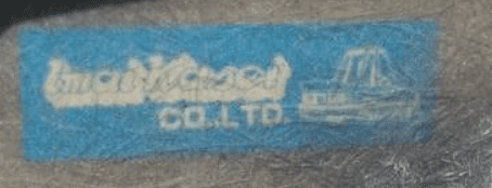 Alt text: Logo of Imai Model Co. LTD on a blue background with an image of a model vehicle, seen on a textured surface.