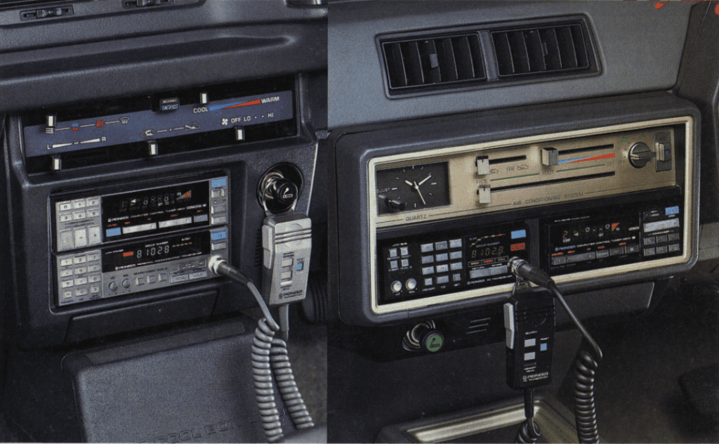 Vintage car dashboards with various controls, dials, and an old Pioneer cassette stereo system for entertainment.