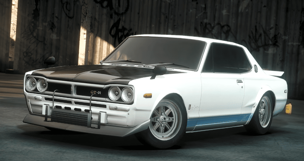 Classic white and black sports car parked in an industrial setting, showcasing vintage design and style.