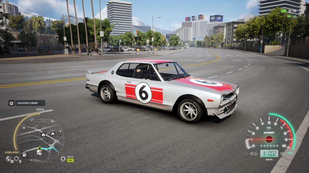 Classic race car with number 6 on city street, video game interface displayed.