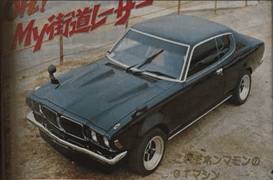 Vintage Japanese sports car with sleek design and dark paint, featured in a retro magazine article.