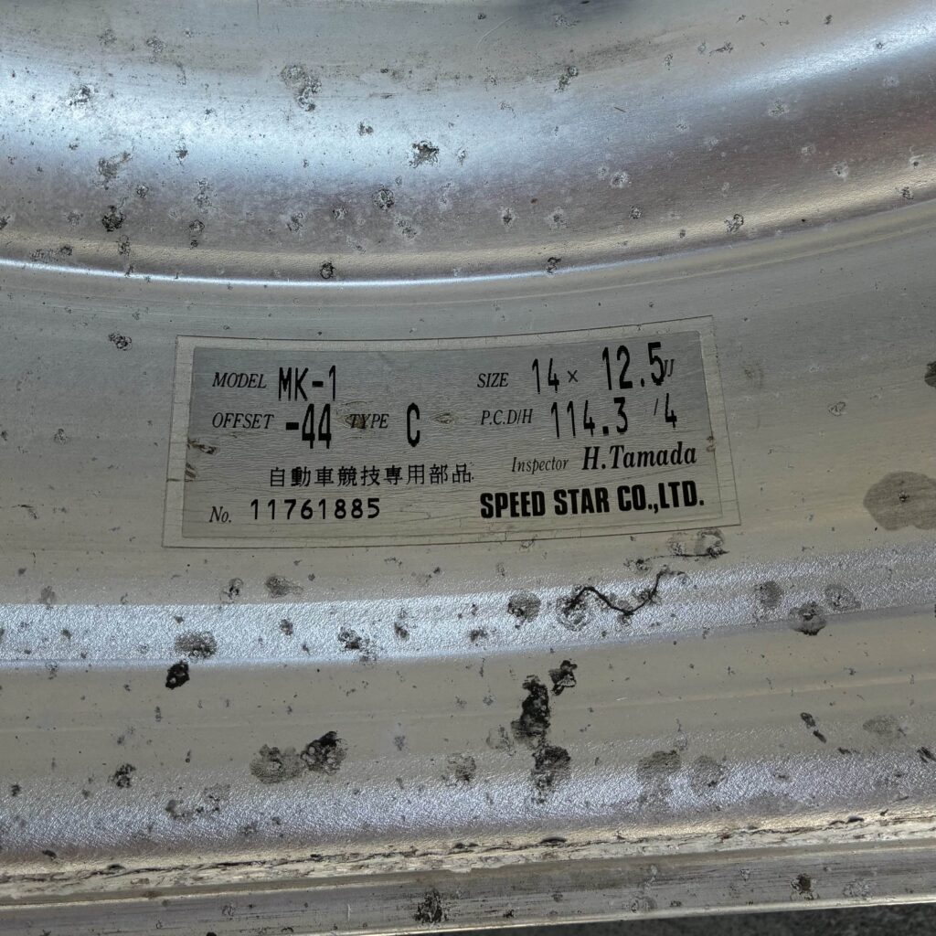 Close-up of a Speed Star Co., Ltd. wheel rim label, displaying model MK-1 specs and details, including offset and size.