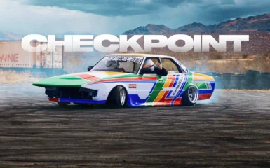 Colorful drift car with driver in helmet sliding on track, CHECKPOINT text in background.